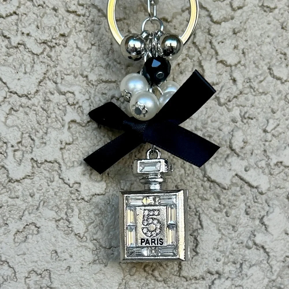 Luxe Silver Perfume Bottle Keychain/Bag Charm with Black Bow